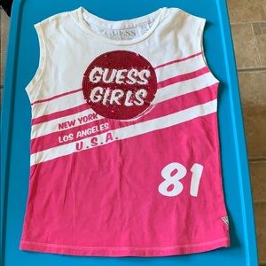 A pink guess shirt